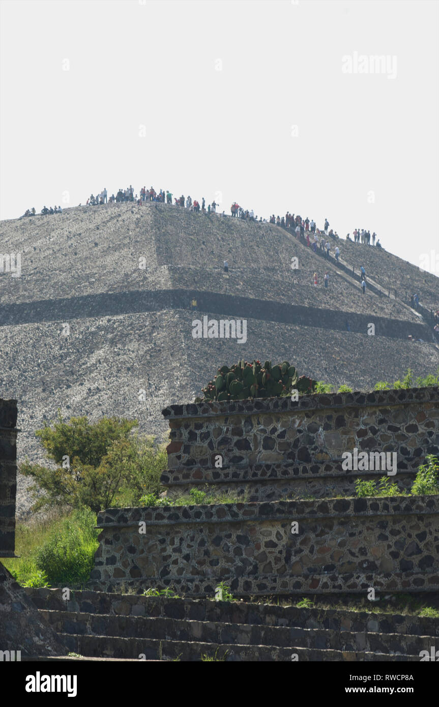 Tourists on top of Pyramid of the Sun overseeing Teotihuacan, Mexico Stock Photo