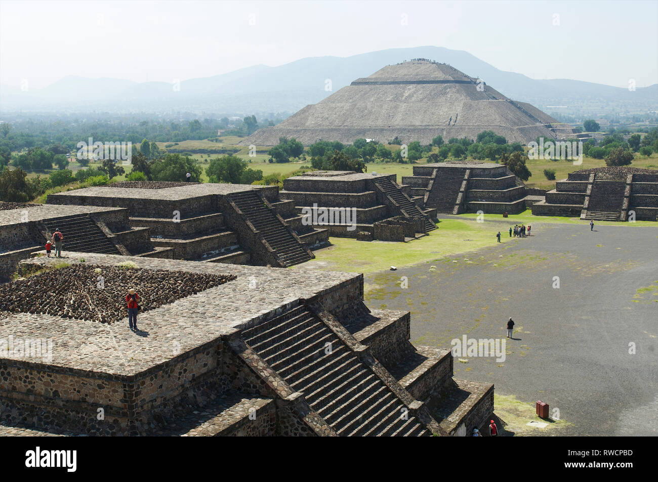 View of tourists on Avenue of the Dead and Pyramid of the Sun and at Teotihuacan, Mexico Stock Photo