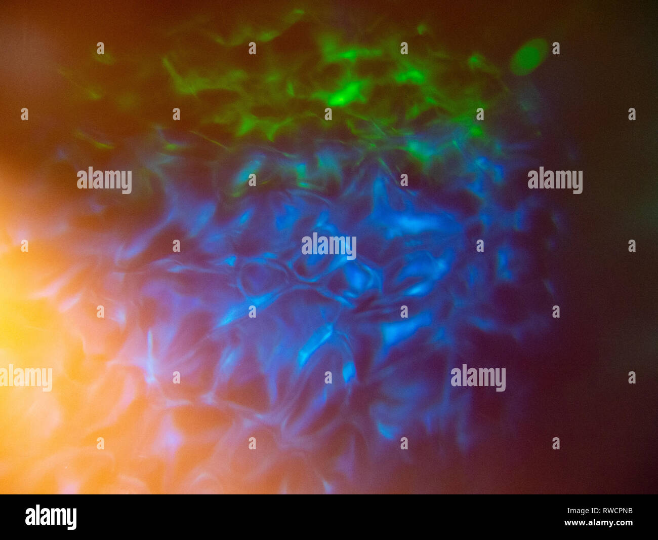 Projected light patterns on an orange wall, Exeter, UK Stock Photo