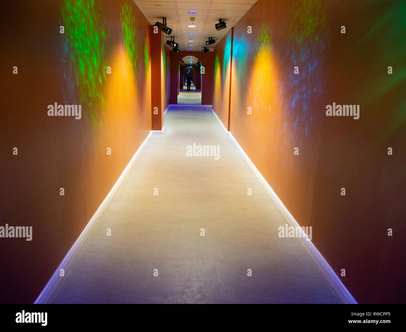 Random light patterns on an orange corridor wall Stock Photo Alamy