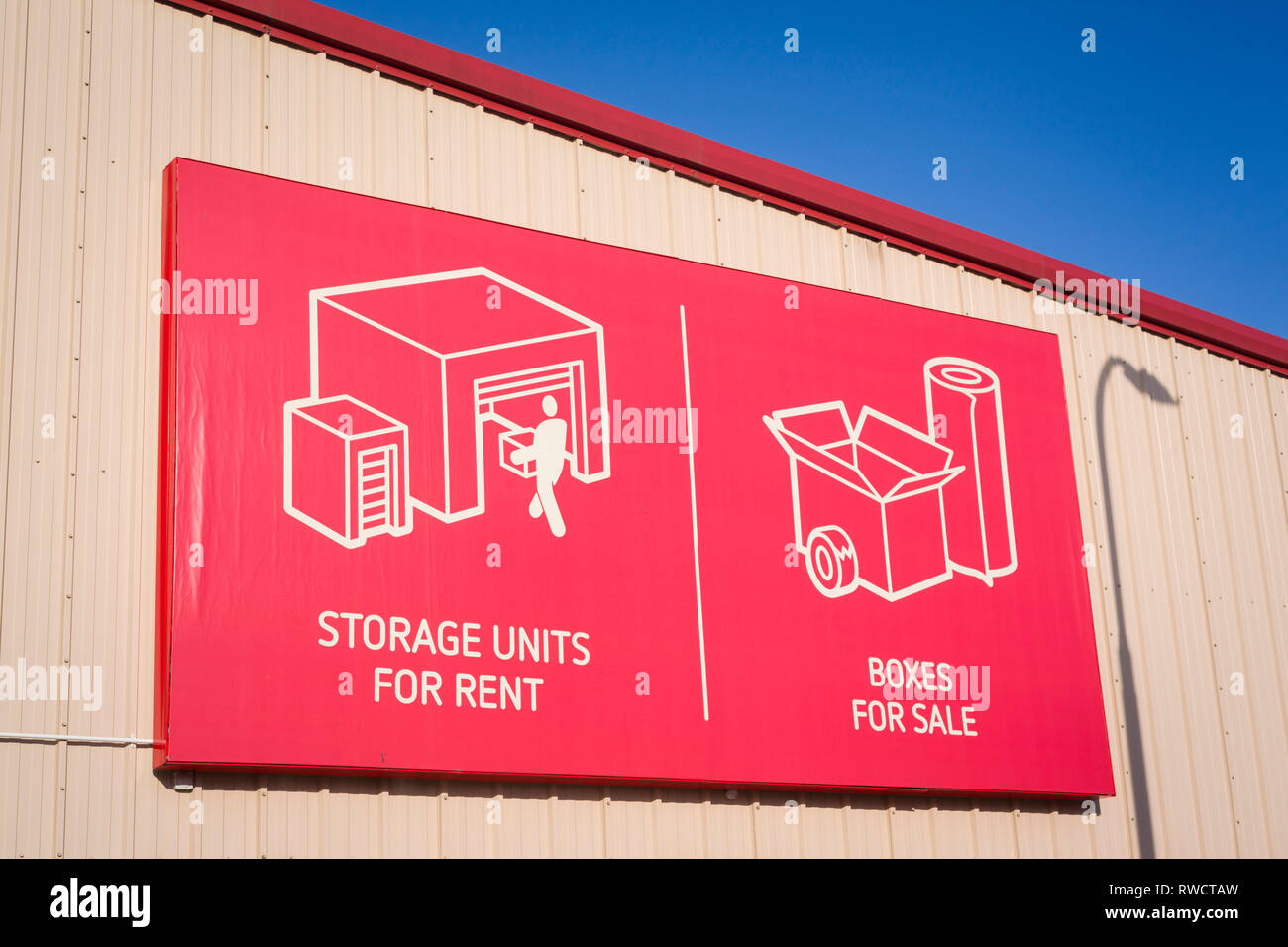 Sign reading 'Storage units for rent' and 'Boxes for sale' on the side of a Shurgard self-storage facility in Caversham, Reading, Berkshire. Stock Photo