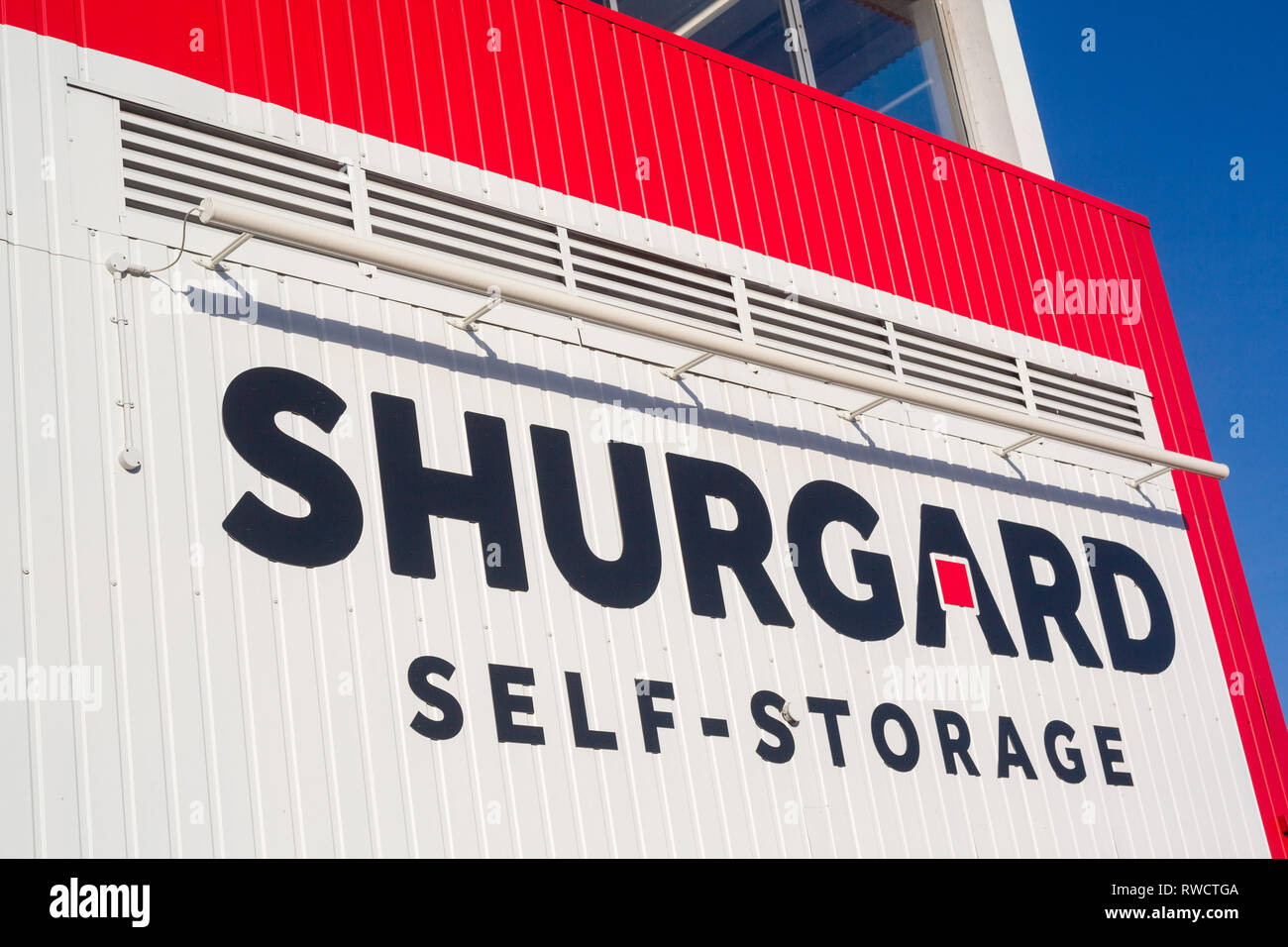 Colourful Shurgard sign on the side of a Shurgard self-storage facility in Caversham, Reading, Berkshire. Stock Photo