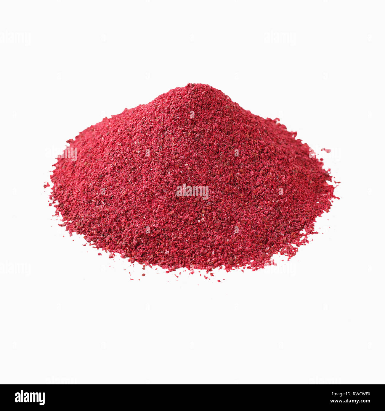 Heap of sumac powder spice isolated on white Stock Photo Alamy