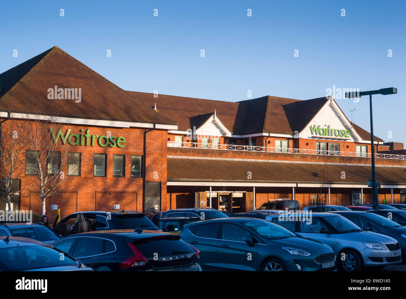 The Waitrose supermarket with parked cars in Henley-on-Thames, Oxfordshire. Stock Photo