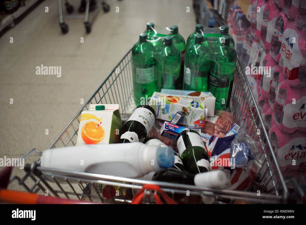A shopping trolley full of shopping stands in a supermarket aisle, in London, Britain March 3, 2019. John Voos - TSL Stock Photo