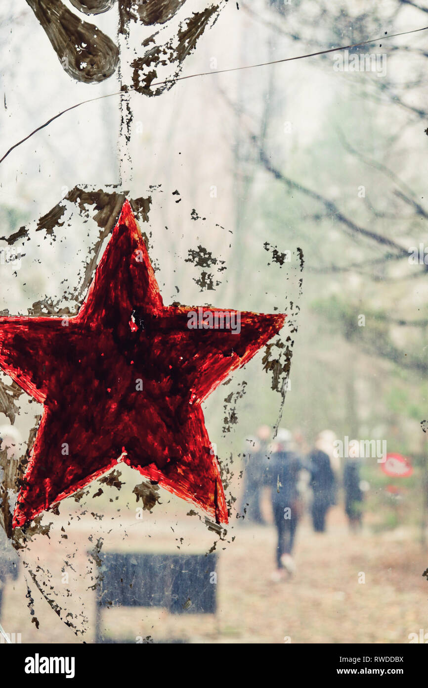 A Soviet red star is painted on the window of the kindergarten inside the Chernobyl exclusion zone Stock Photo