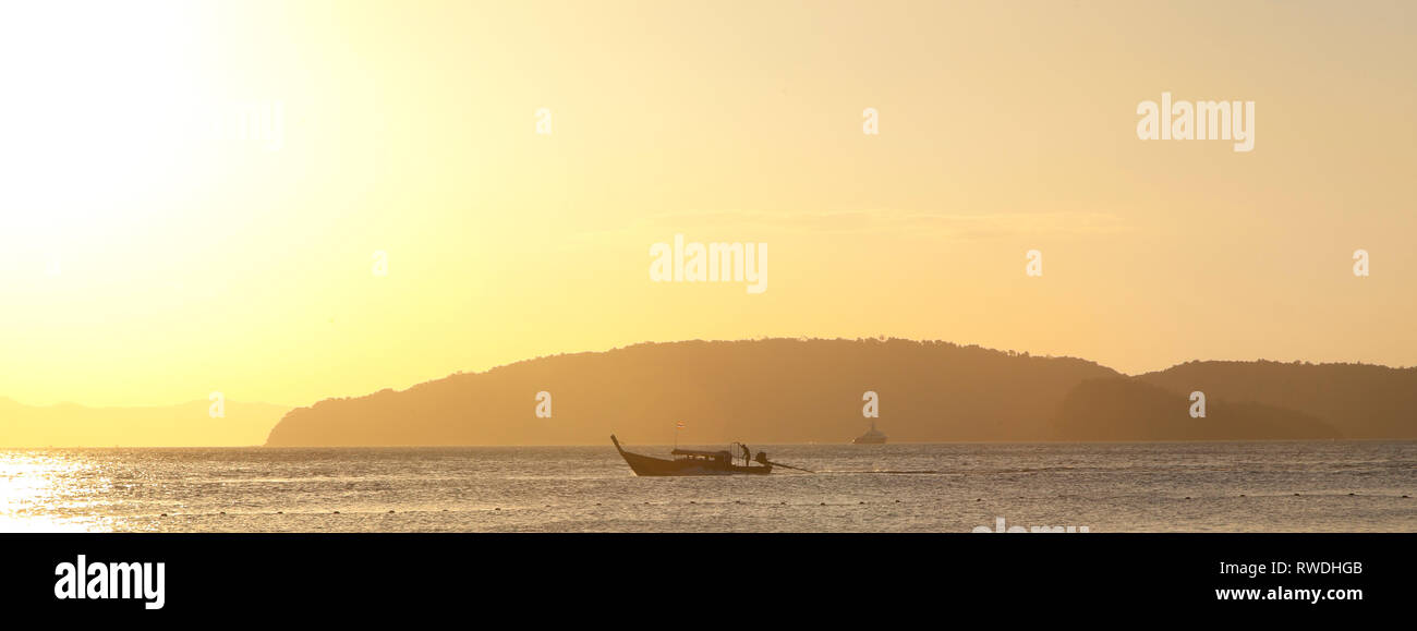 Long tailed boat for island hopping, Aonang, Krabi, Thailand, evening sun Stock Photo
