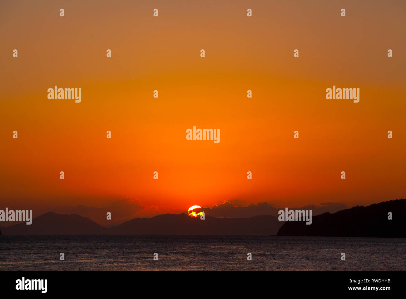 Setting sun over the Andaman sea, Thailand Stock Photo