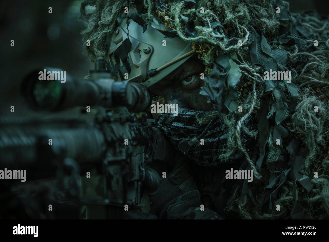 United States Army ranger sniper wearing ghillie suit. Stock Photo