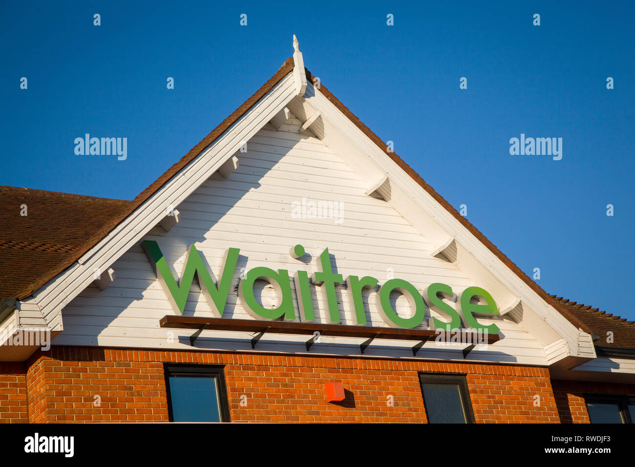 The Waitrose sign on the front of the Waitrose store in Henleyon