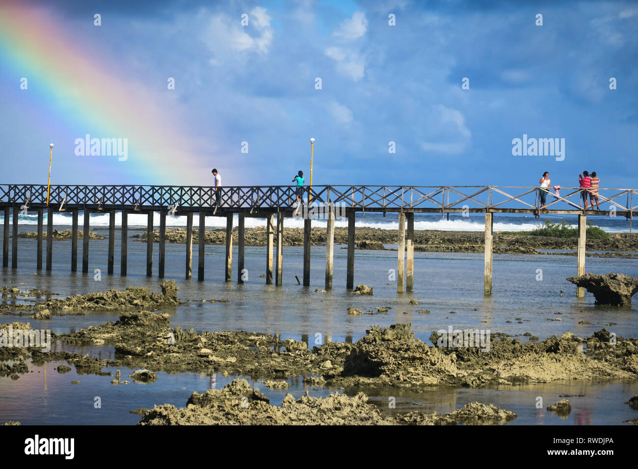 Rainbow Closeup, Beach Boardwalk at Cloud 9 - Siargao, Philippines Stock Photo