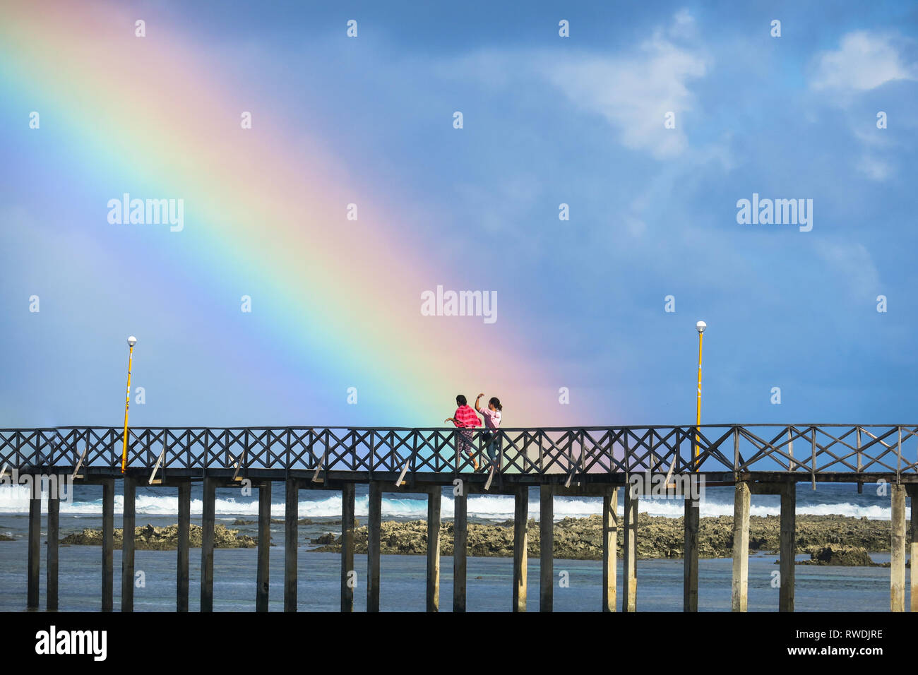 Rainbow Closeup at Beach Boardwalk - Cloud 9, Siargao - Philippines Stock Photo