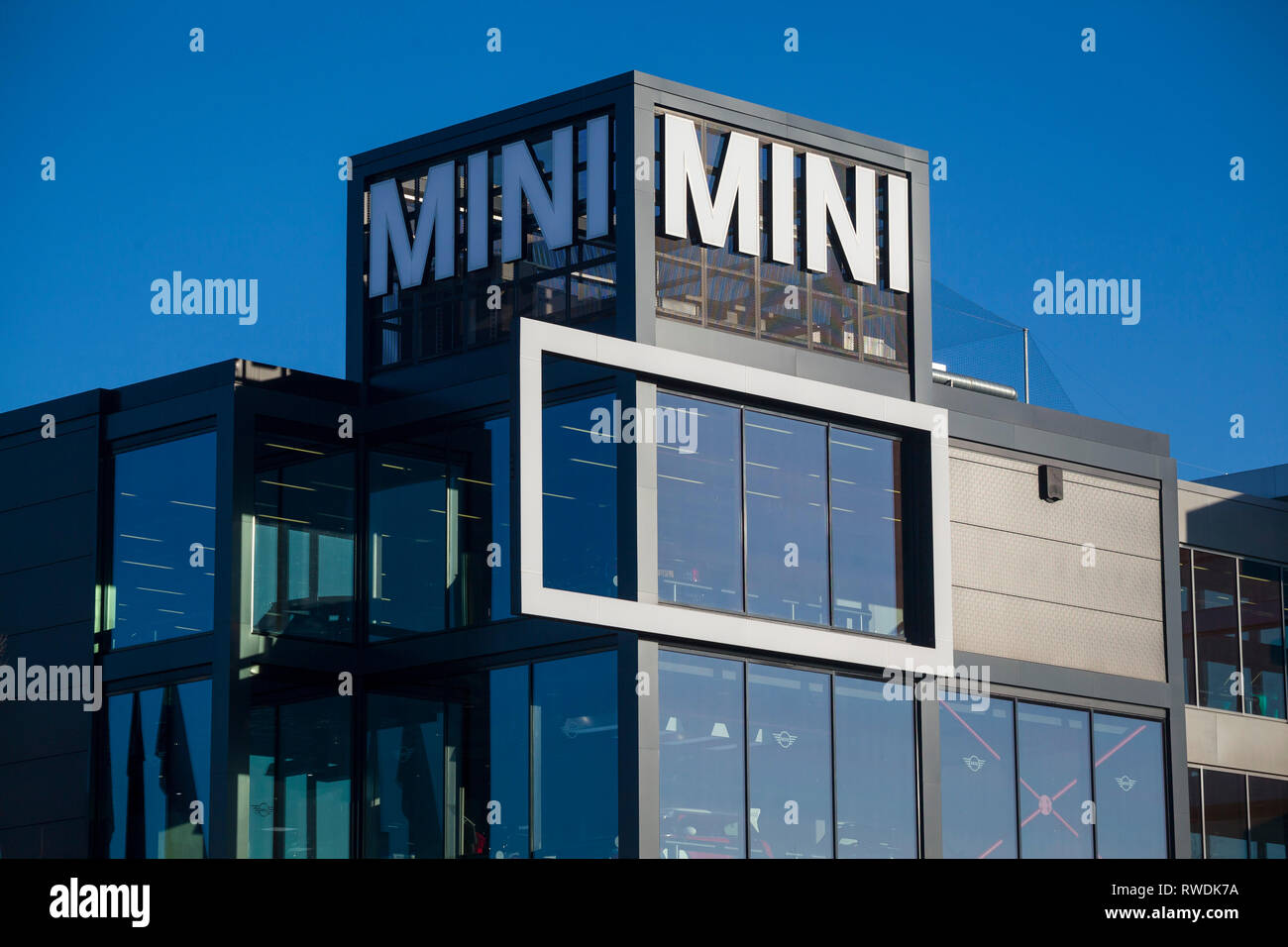 The BMW Mini sign on the showroom and offices of Cooper BMW in Reading, Berkshire. Stock Photo