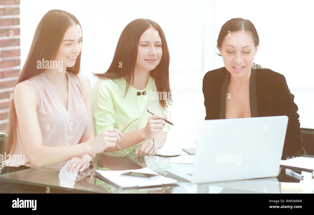 three business women working in a modern office Stock Photo