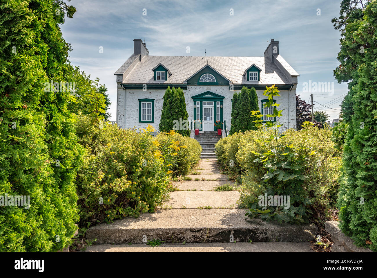 Central perspective view of the old presbytery of Cacouna, Province of Quebec, Canada Stock Photo