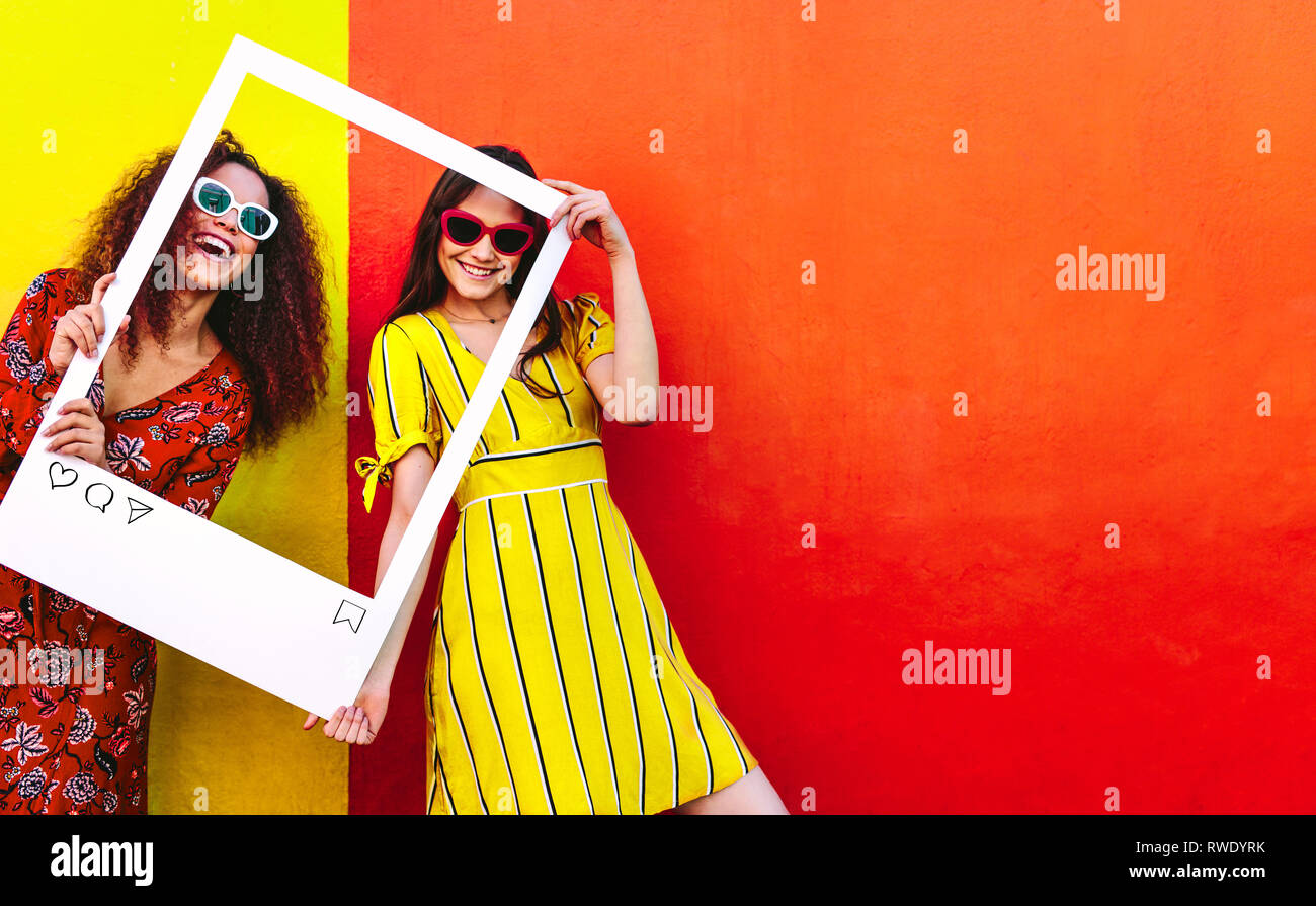 Portrait of Two Young Beautiful Fashionable Girls Posing in Street. Models  Wearing Stylish Sunglasses and Light-colored Stock Image - Image of  outside, girl: 193626565