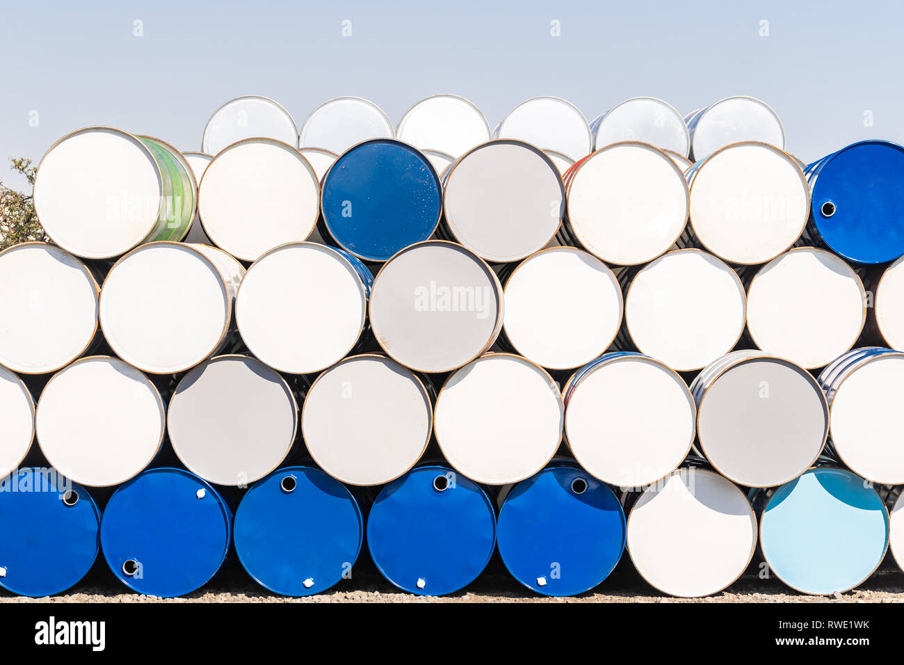 Industry oil chemical metal barrels stacked up in waste yard of tank and container, Kawasaki city near Tokyo Japan Stock Photo