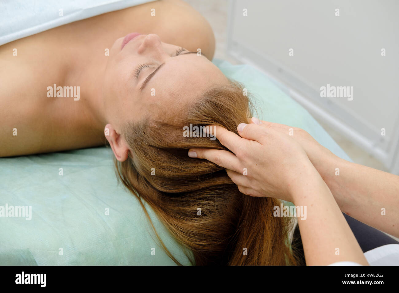 Woman On Spa Massage Treatment In Beauty Spa Salon Cosmetologist