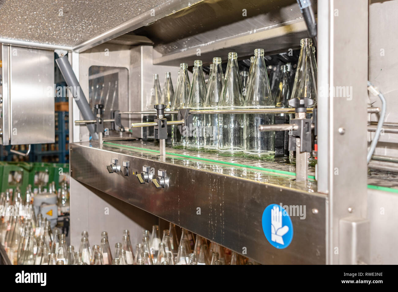 Before filling beverage bottles are cleaned in an industrial dishwasher especially for many