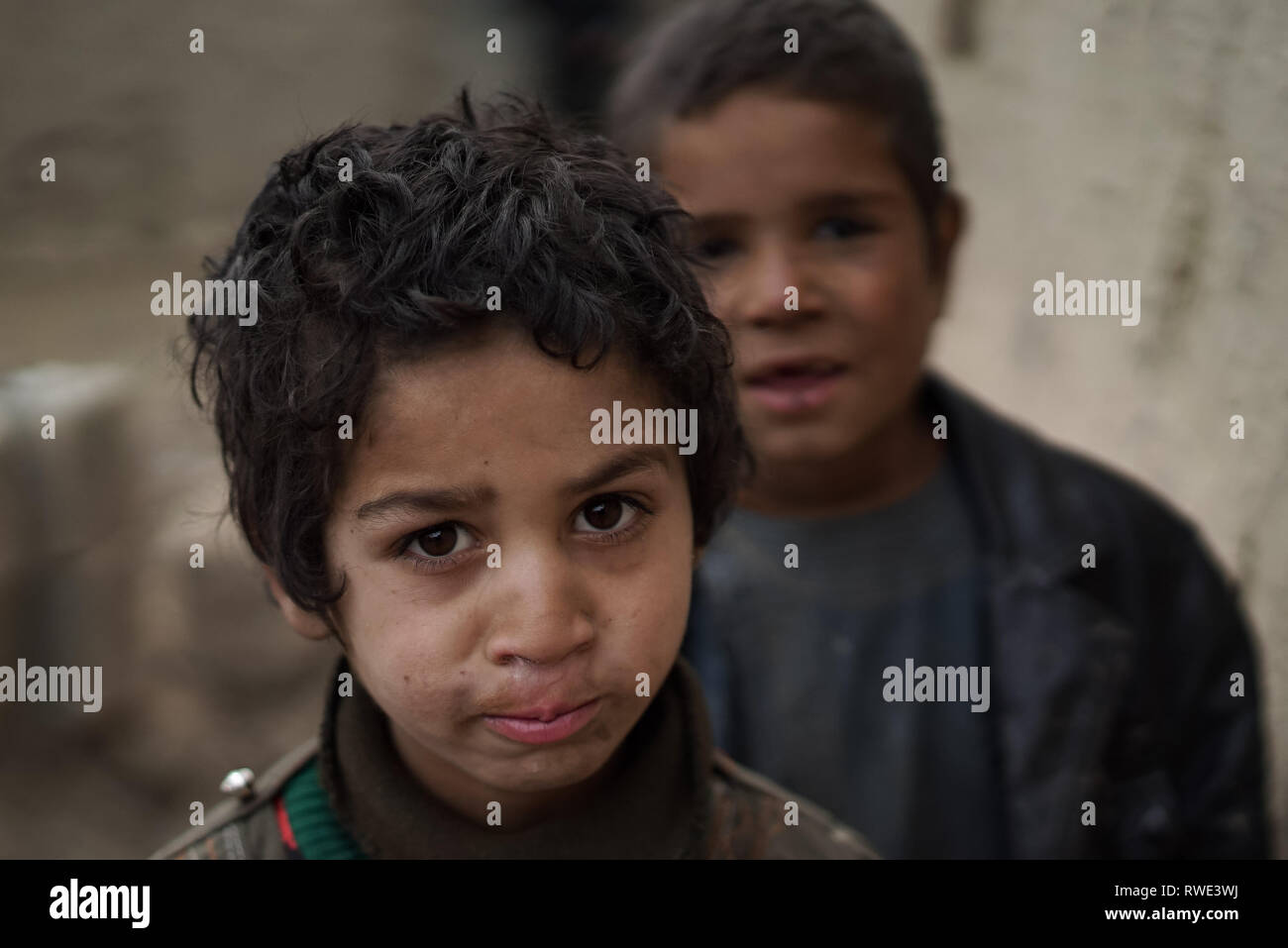 People in an IDP camp on the outskirts of Kabul, Afghanistan, 28 Feb 2019. Most of the 1000 families leaving in the camp left Afghanistan's Helmand province 13 years ago when the Taliban launched a massive military offensive on the afghan army and coalition forces in Helmand.  Now most of the households have more than 10 members, according to the camps leader, they have no medical center in the camp and the school can teach only a max 80 children. The poor infrastructure and hygiene make illnesses such as gastrointestinal infections, skin infections, and respiratory diseases prevalent. Stock Photo