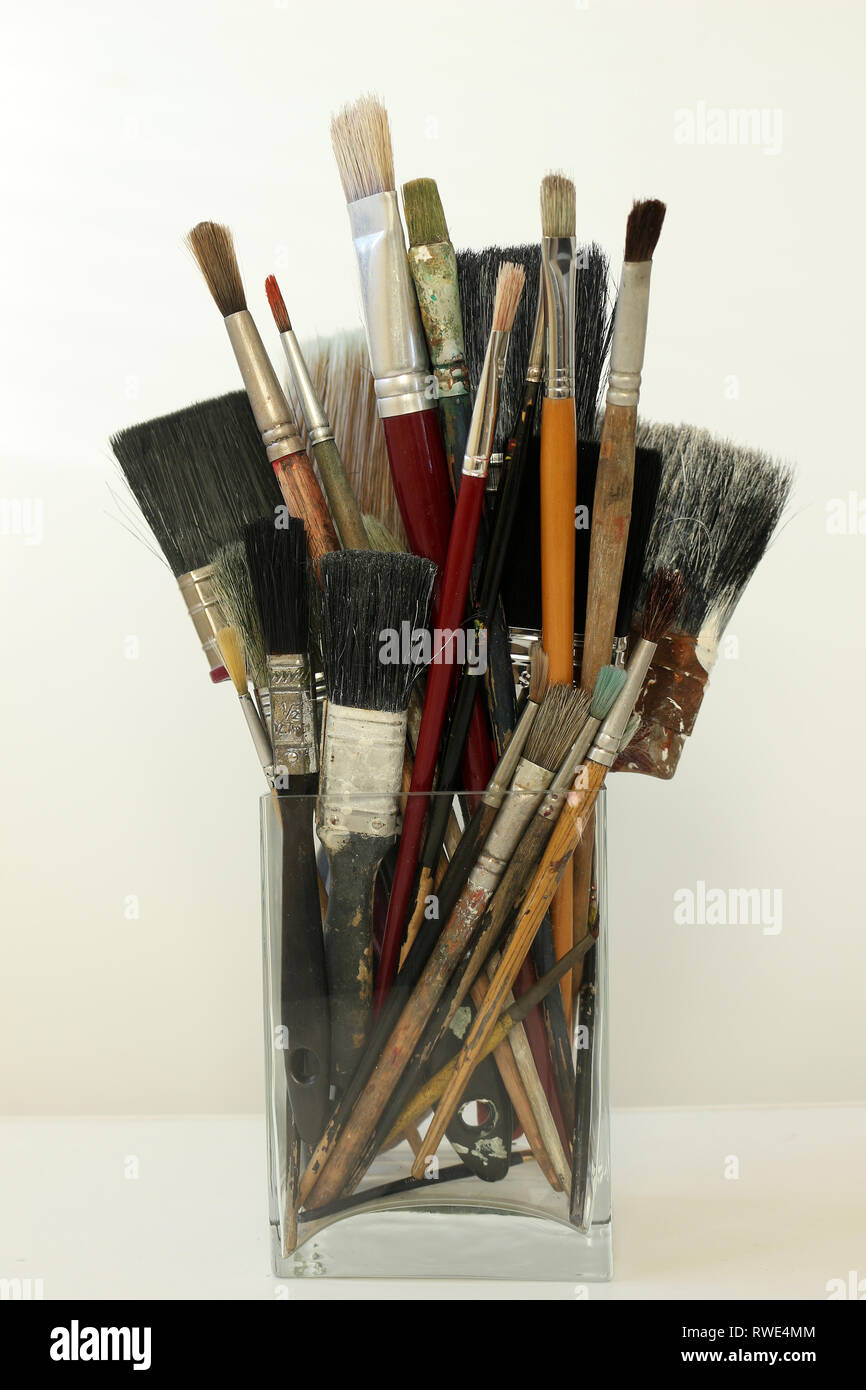 Close up of artist's paintbrushes in jars with artsy bohemian vintage  background Stock Photo - Alamy