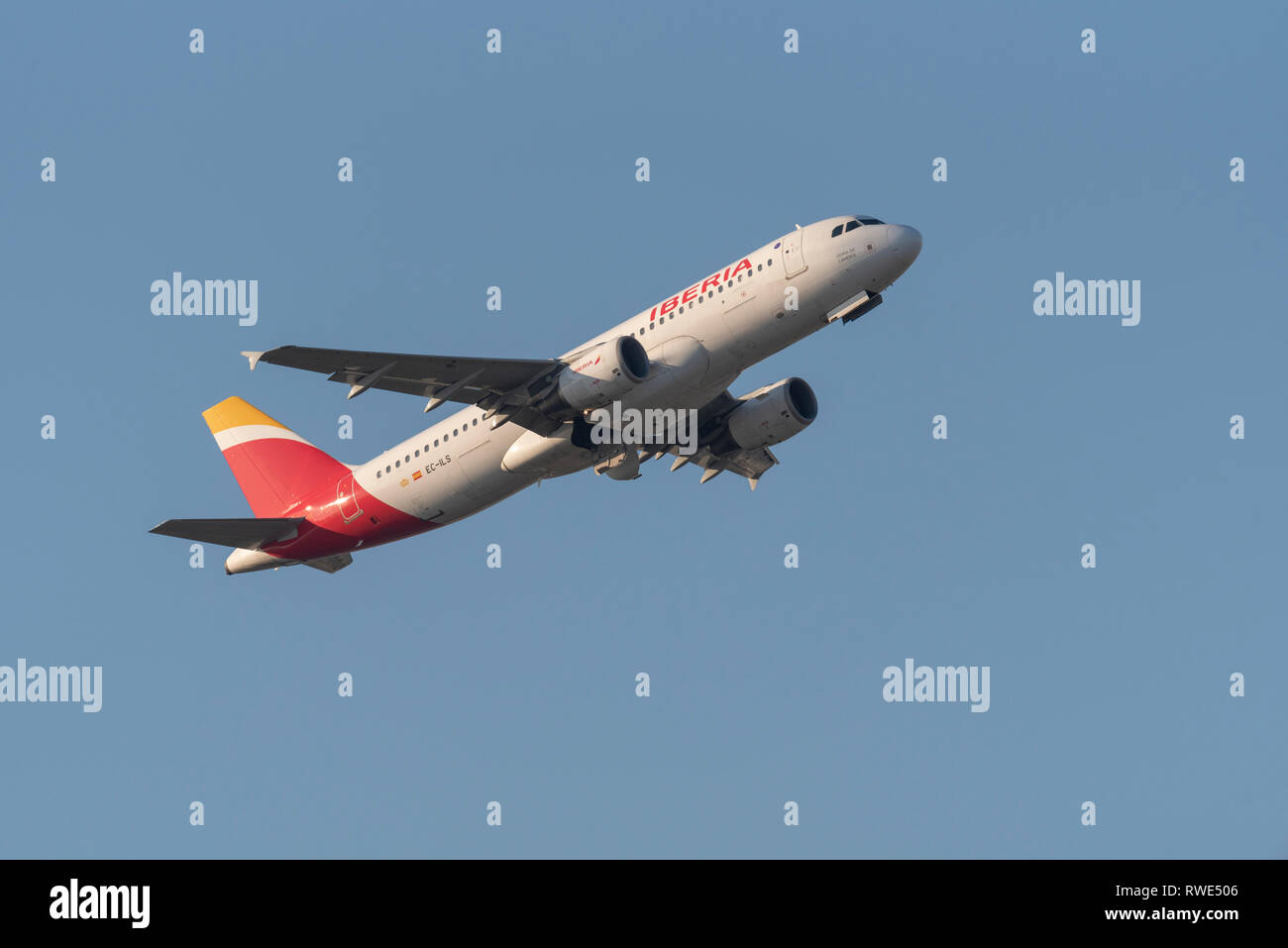 Iberia Airbus A320 jet plane airliner EC-ILS taking off from London Heathrow Airport, UK, in blue sky. Named Sierra de Cameros Stock Photo