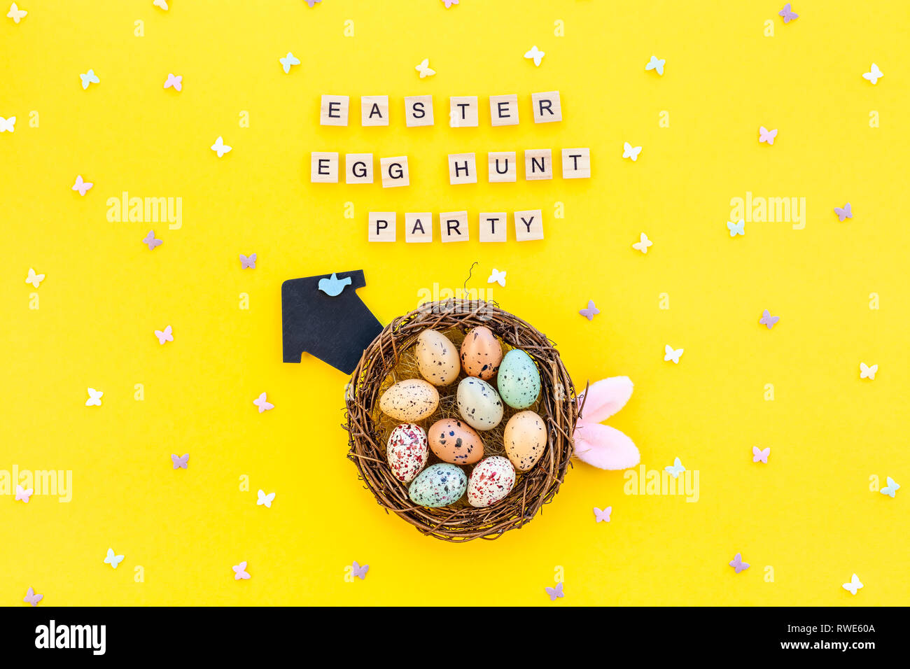 Creative Top view flat lay holiday composition Easter bunny ears eggs ...