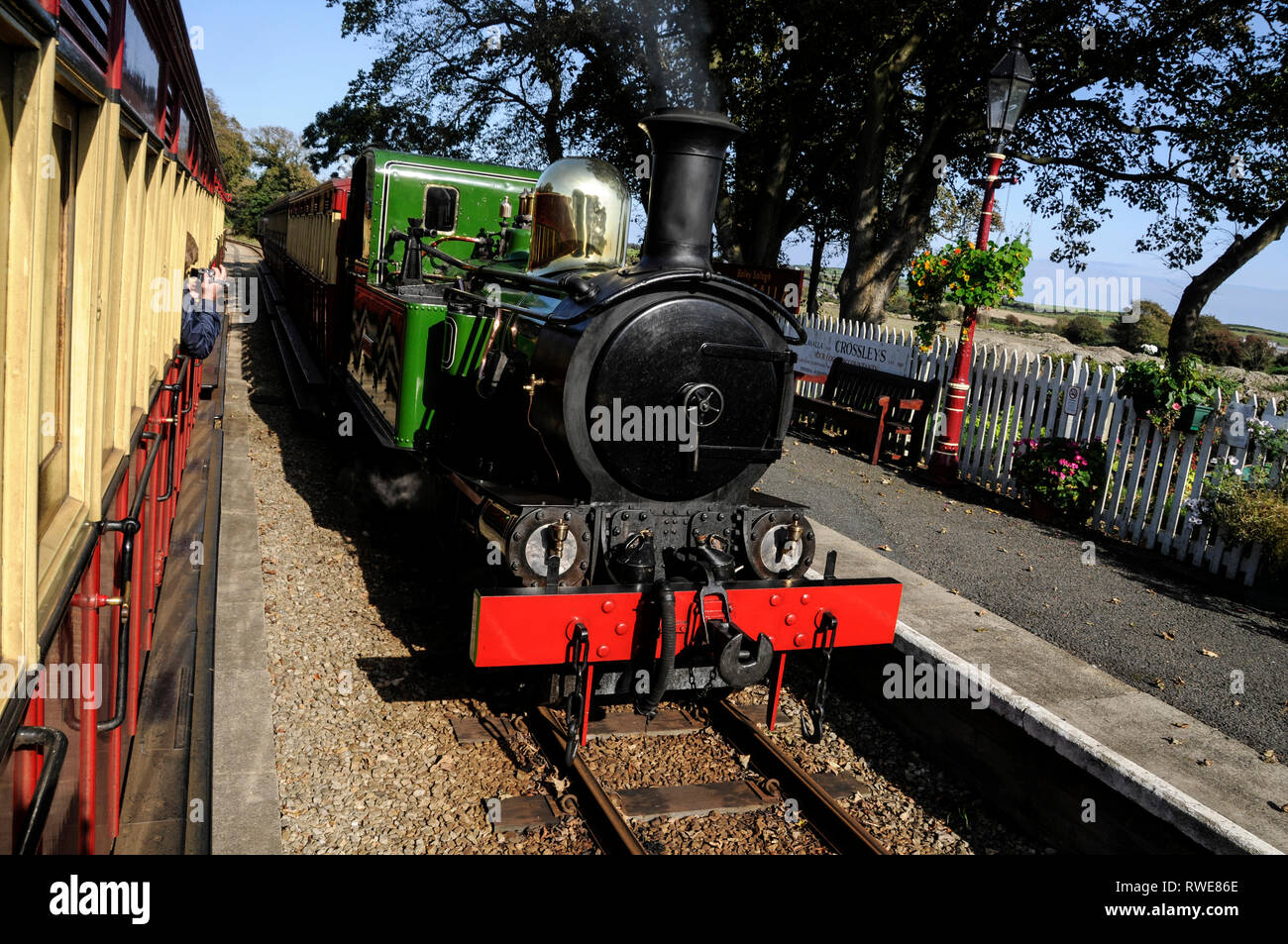 On board the small steam train passing another steam train on the