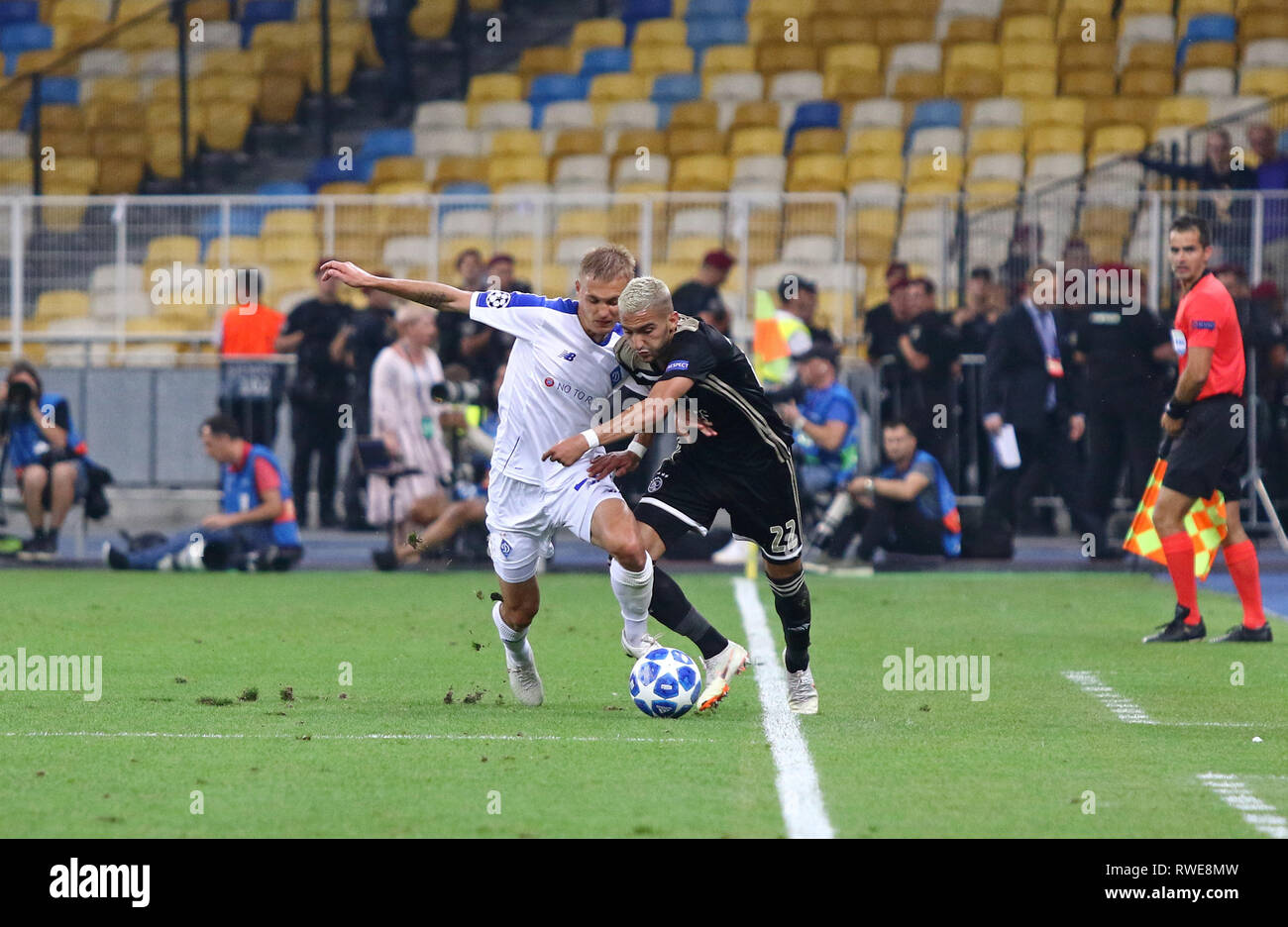 KYIV, UKRAINE - AUGUST 28, 2018: Vitaliy Buyalskiy of FC Dynamo Kyiv (L) fights for a ball with Hakim Ziyech of AFC Ajax during their UEFA Champions L Stock Photo