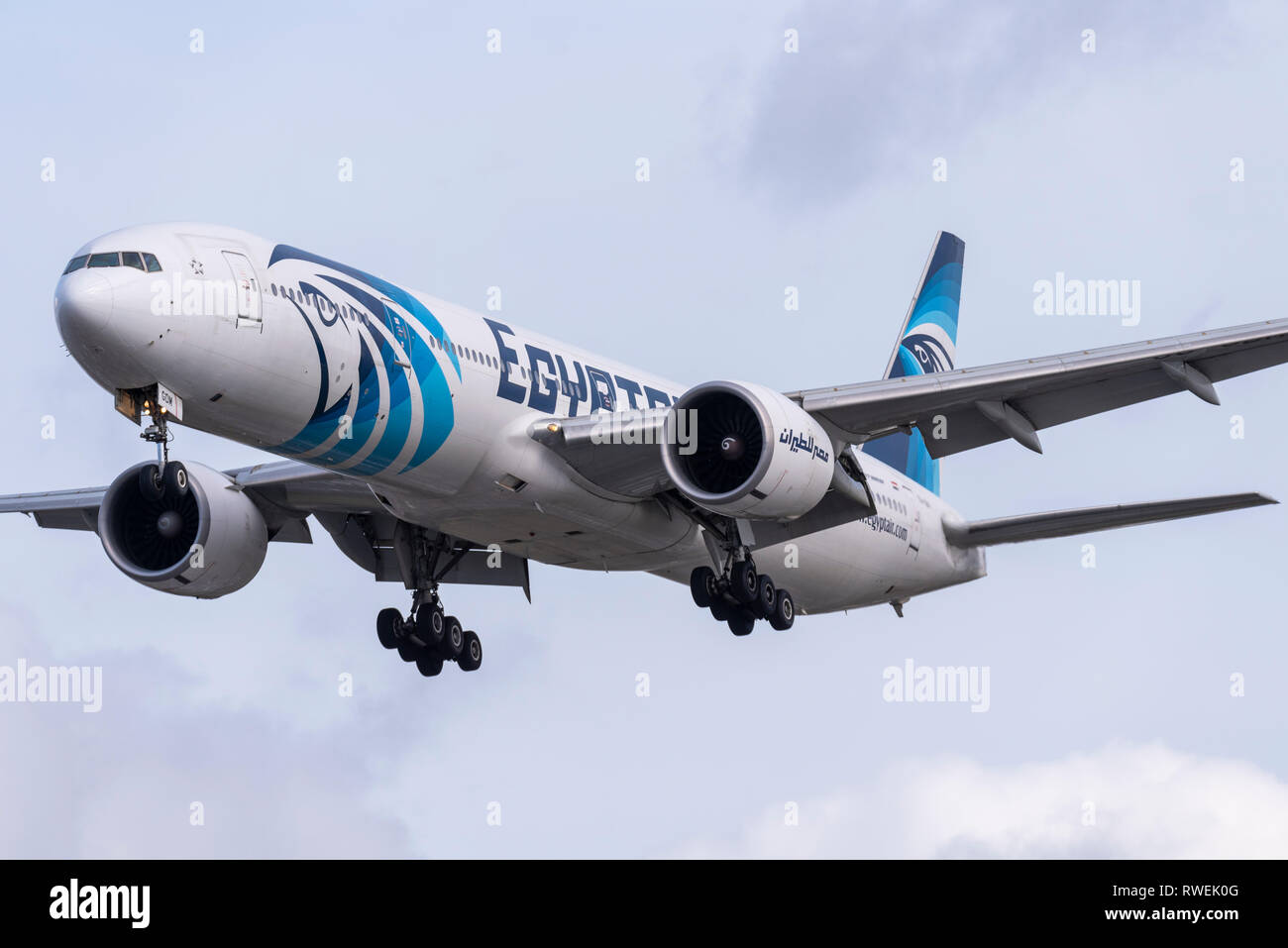 Egyptair Boeing 777 jet plane airliner landing at London Heathrow Airport, UK. Horus scheme Stock Photo