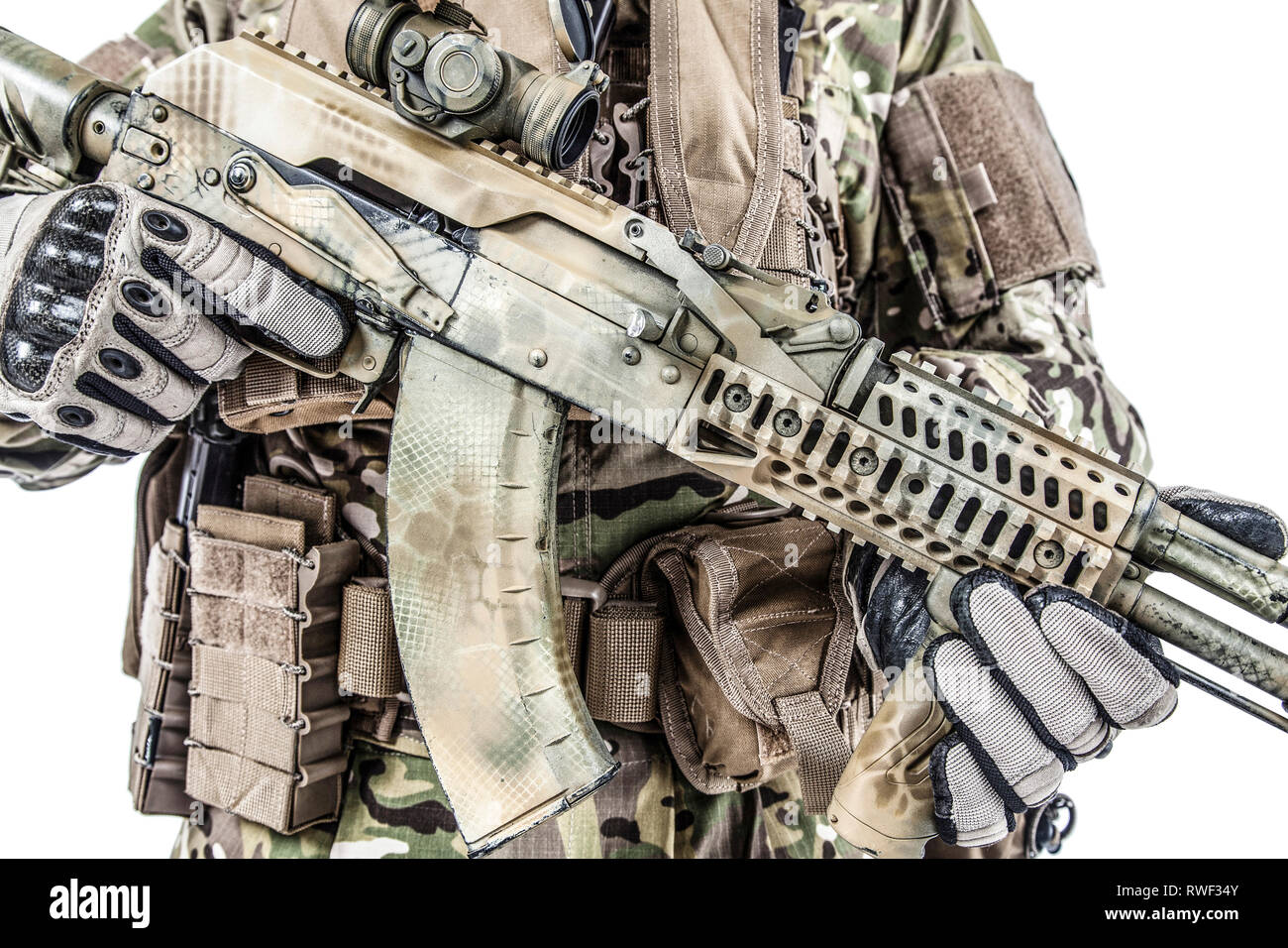 Close-up shot of Kalashnikov rifle in hands of Army special forces soldier. Stock Photo