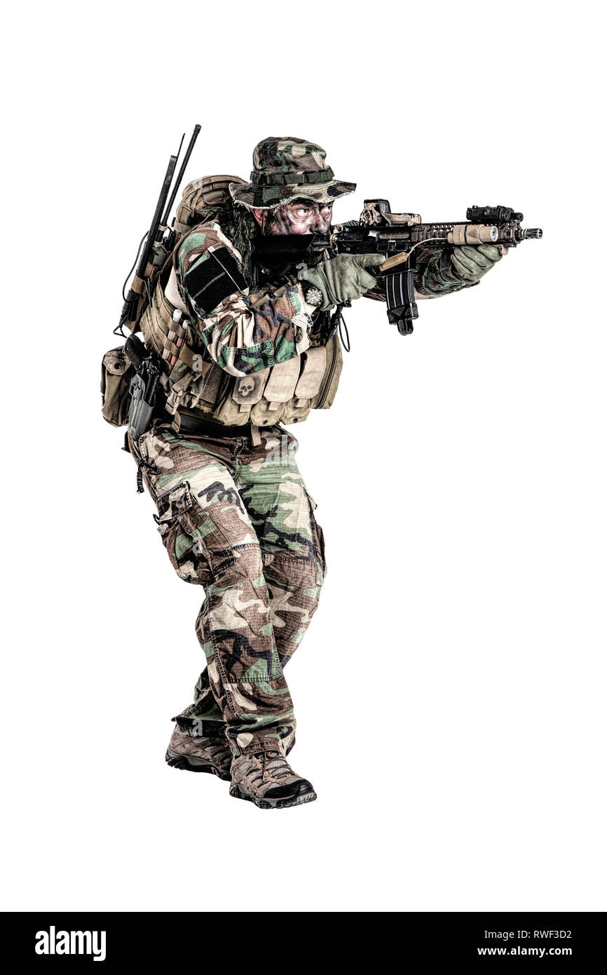 U.S. special forces soldier shooting on the move. Stock Photo