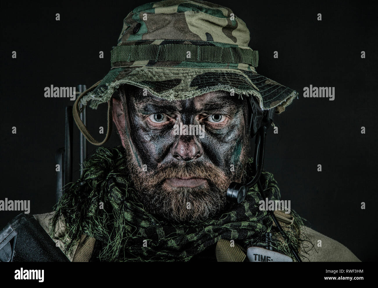 Studio shot of a U.S. special forces soldier wearing a jungle hat and