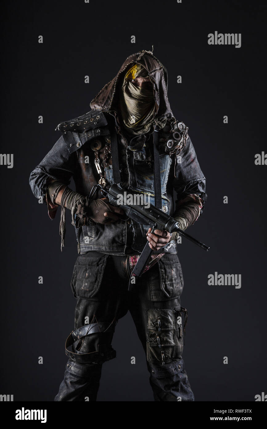 Grimy apocalypse survivor with homemade weapon Stock Photo - Alamy