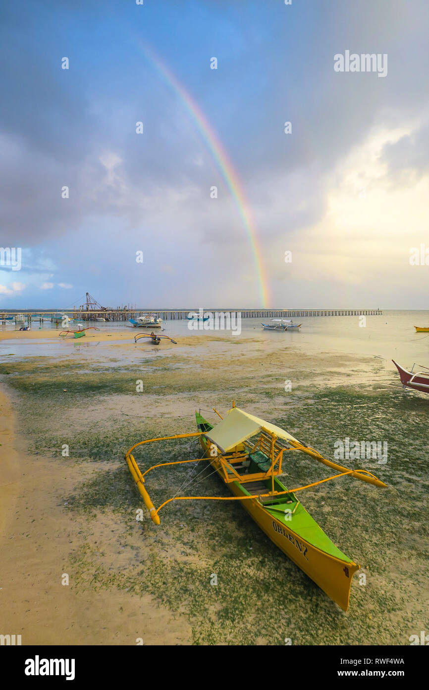 Yellow Tour Boat Beautiful Island Rainbow - General Luna, Siargao, Philippines Stock Photo