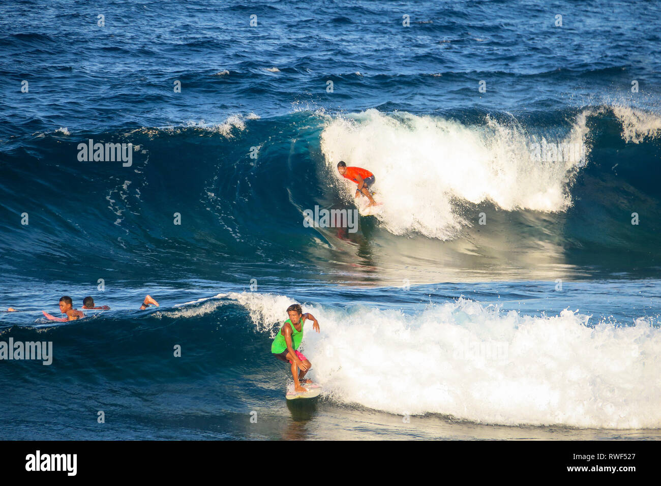 2 Surfers Catching 2 Waves at the Same Time -  Cloud 9, Siargao - Philippines Stock Photo