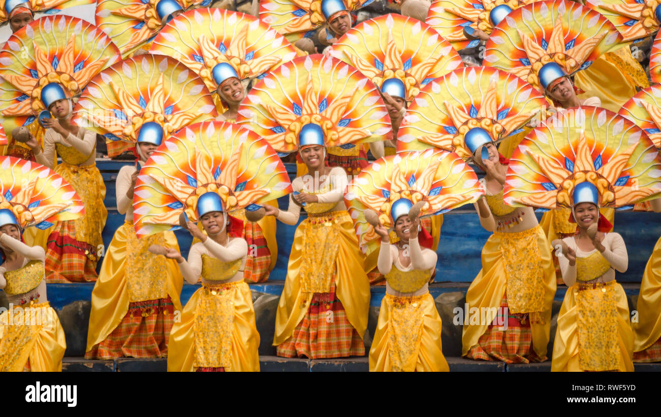 Women dancers in Yellow at Binirayan Festival, San jose, Antique - Philippines Stock Photo