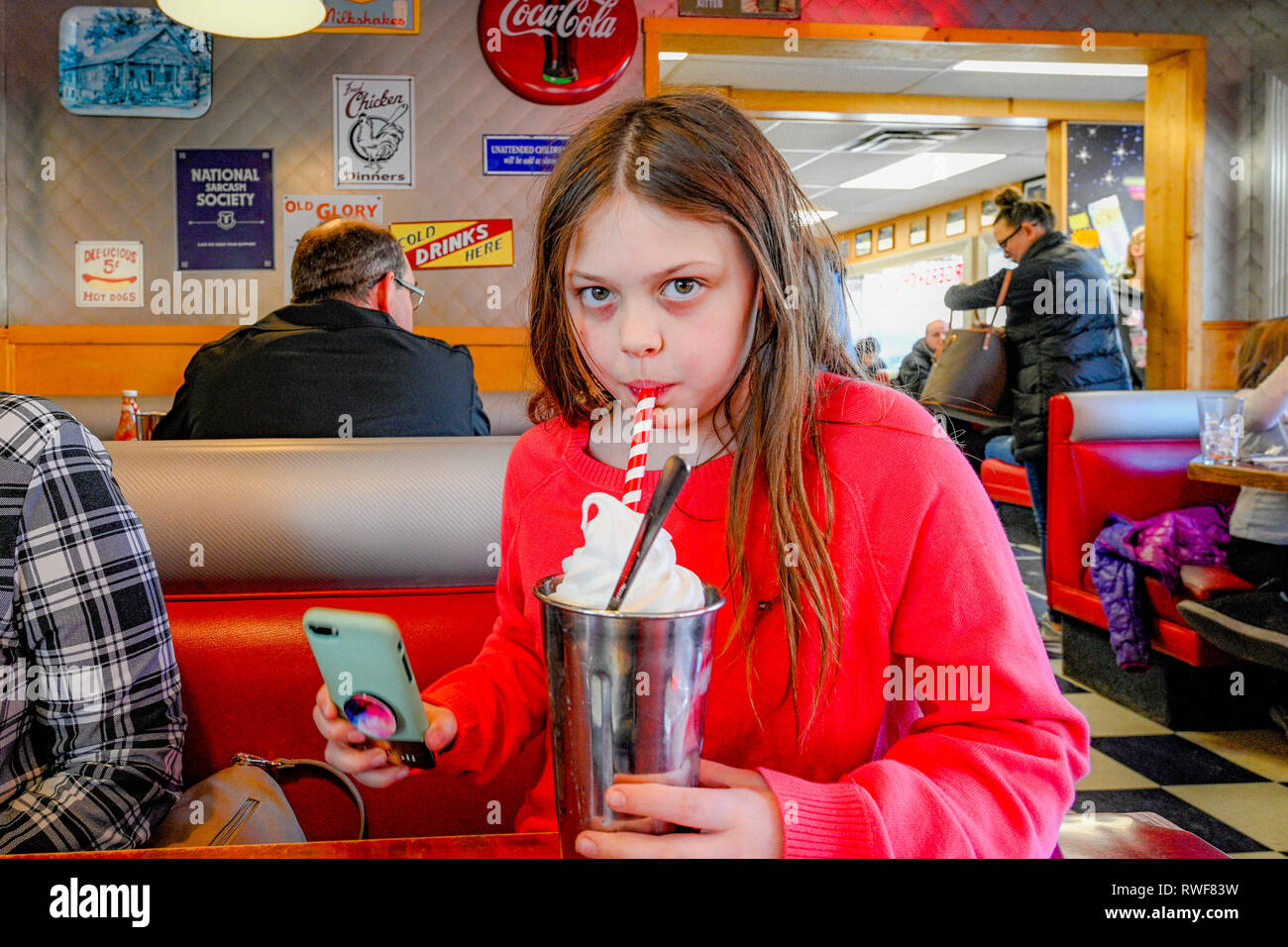 Young girl drinking milkshake at Rocko's Diner, Mission, British Columbia,  Canada. where filming for Pop's Diner in the tv series Riverdale took plac  Stock Photo - Alamy