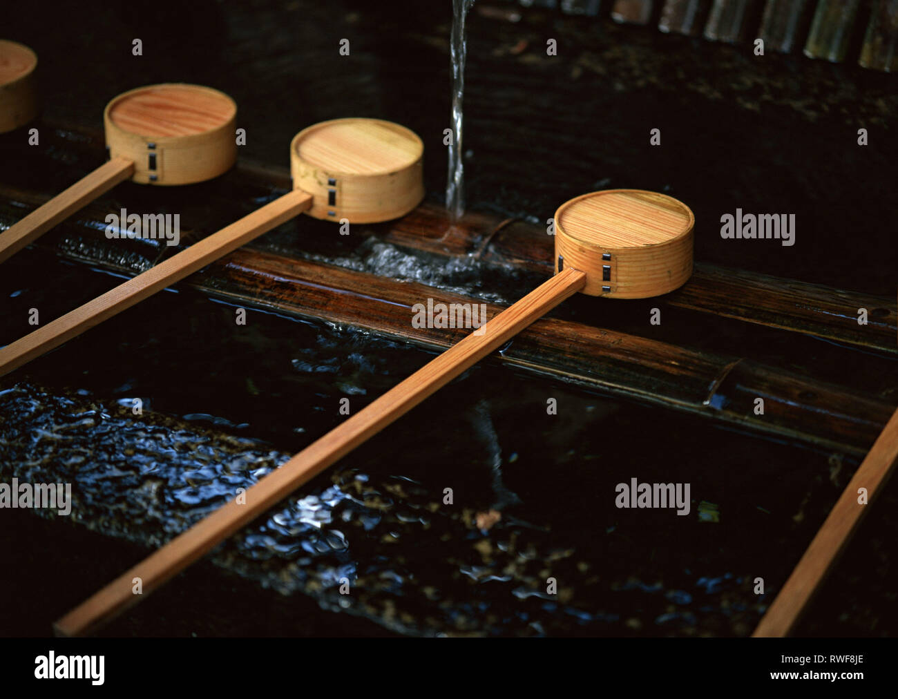 Japanese wooden stick instrument with circular head background Stock Photo