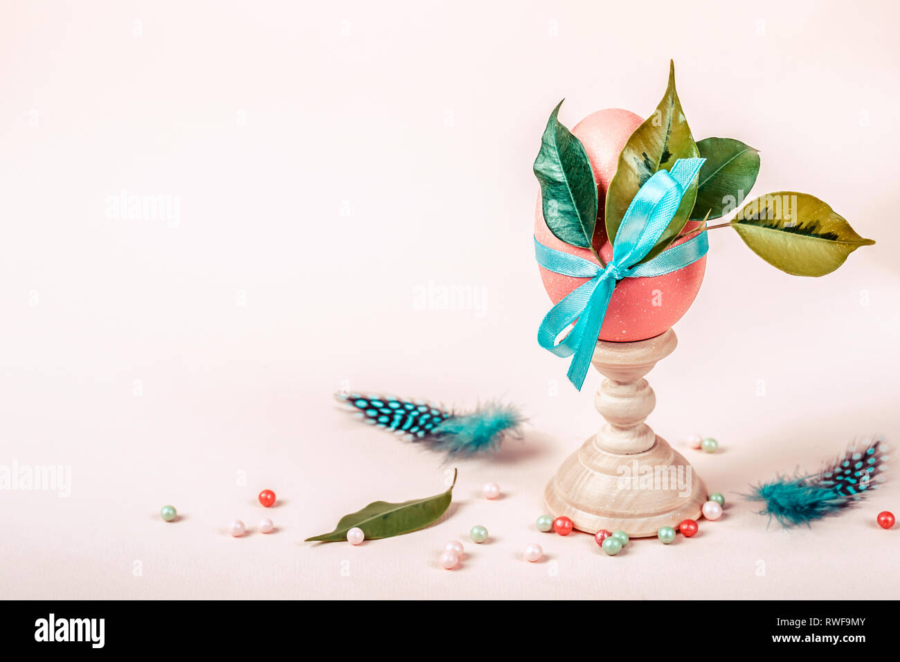 Easter greeting card with decorated egg on stand. Stock Photo