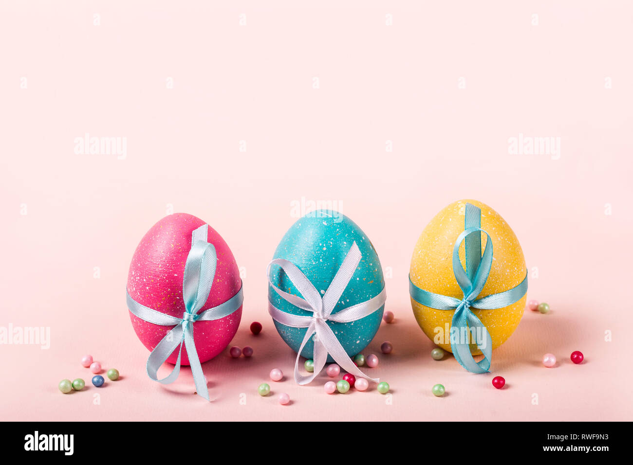Three decorated eggs are in a row. Easter concept. Stock Photo