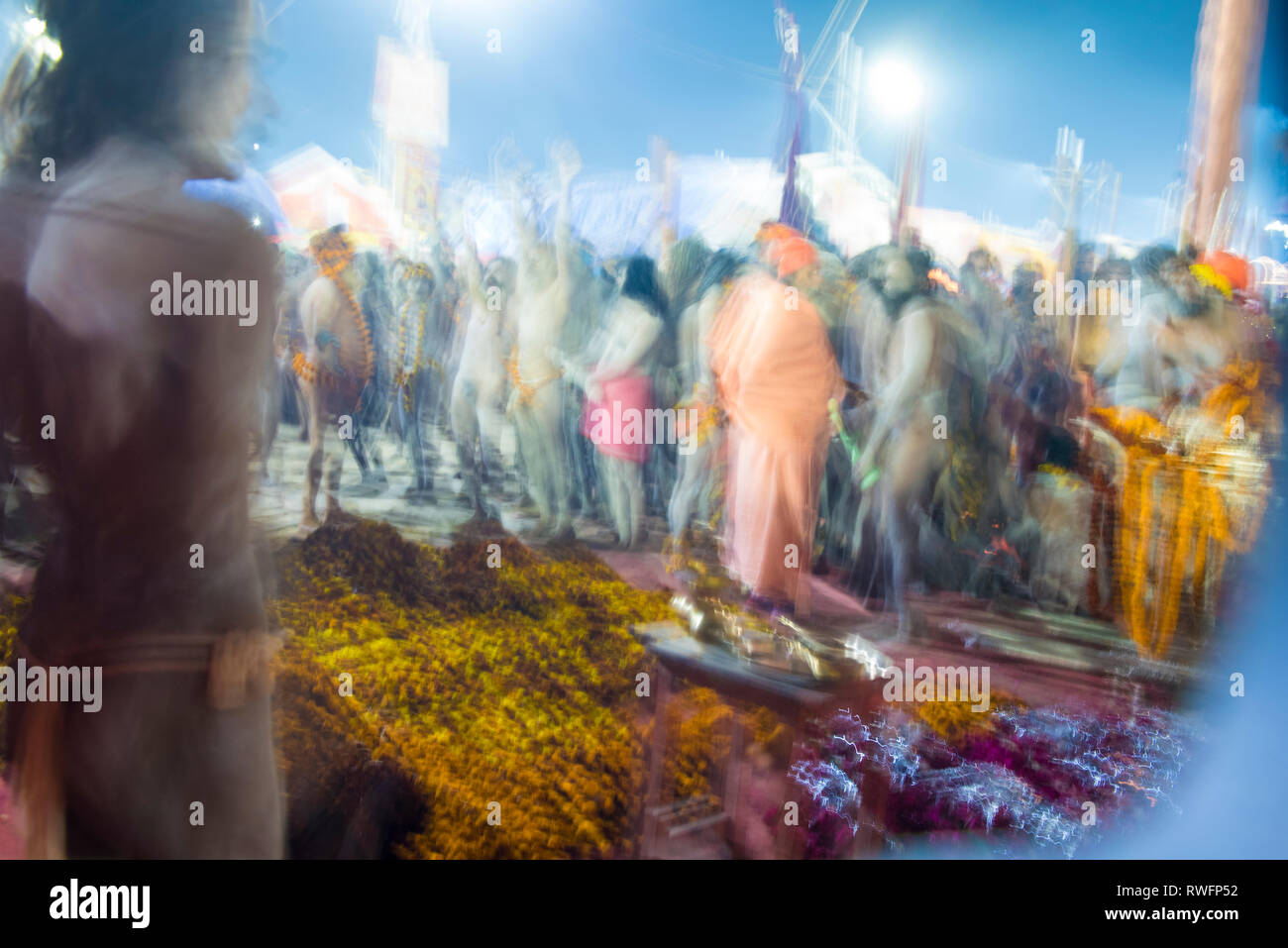 Allahabad / India 14 January 2019 Blurred Image ( slow shutter speed ) of naga baba sadhu holy man ready for holy bath at Prayagraj Kumbh Mela in Alla Stock Photo