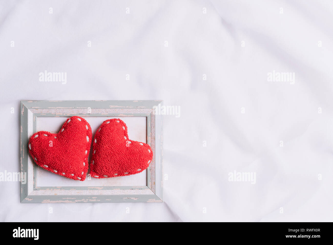 Valentines Day and symbol of love. Two red hearts in picture frame on ...