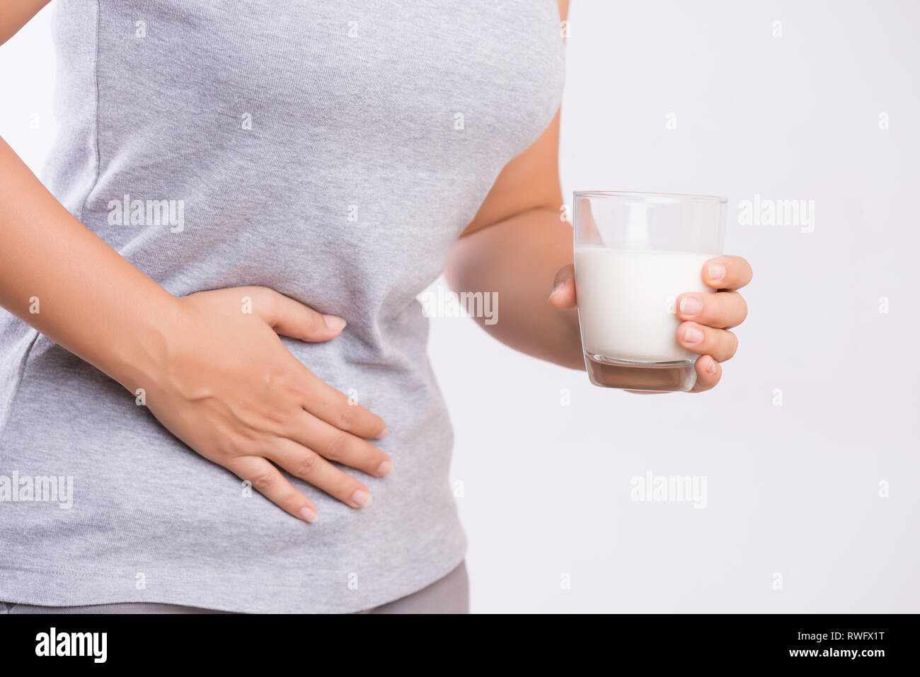 Woman Hand Holding Glass Of Milk Having Bad Stomach Ache Because Of Lactose Intolerance Health Problem With Dairy Food Products Healthcare And Medic Stock Photo Alamy