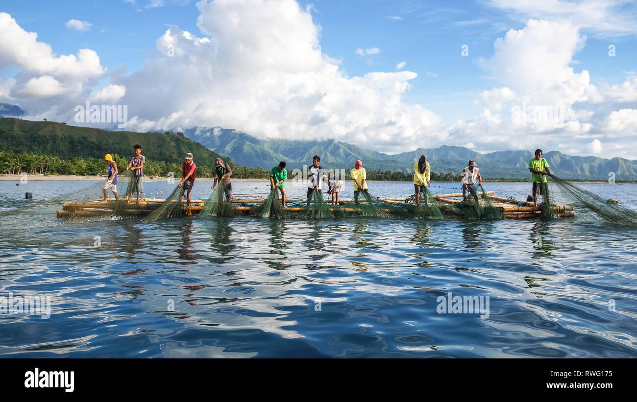 Fishermen Pulling Large Nets from Bamboo Raft, known as Lambaklad