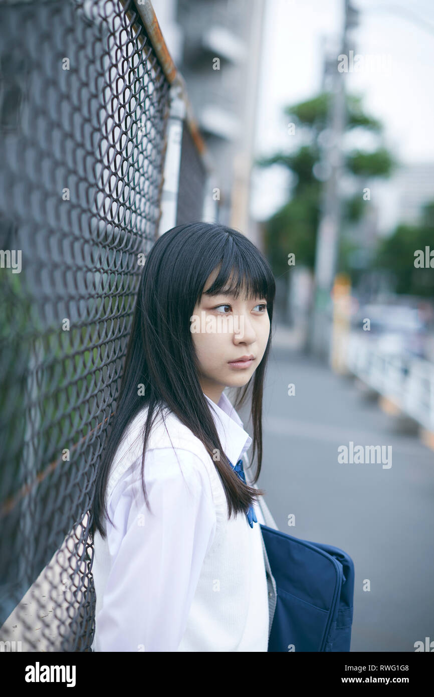 Japanese high school student in uniform downtown Tokyo Stock Photo Alamy