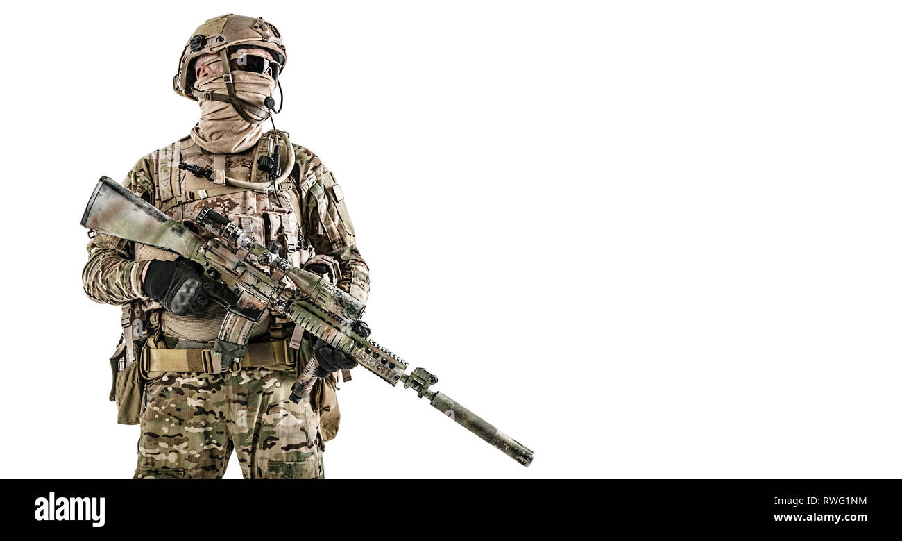 Studio shot portrait of special forces soldier in field uniform with weapon. Stock Photo