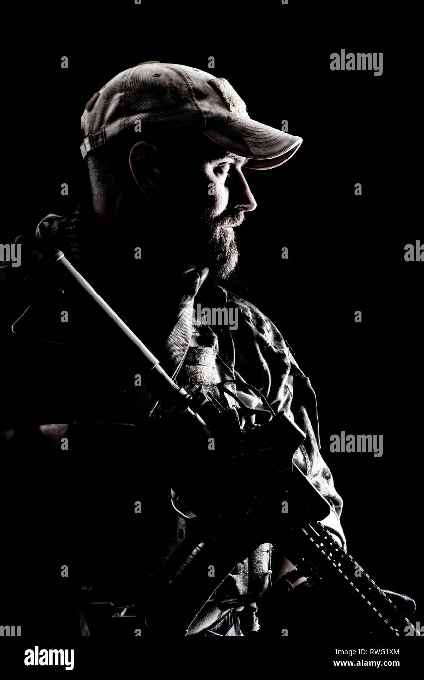 Bearded special forces soldier in uniform with weapon Stock Photo