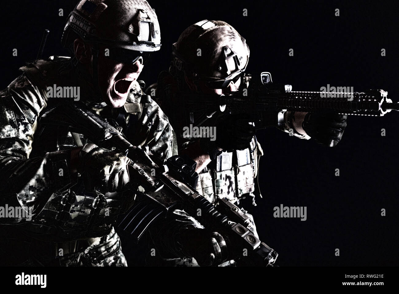 https://c8.alamy.com/comp/RWG21E/two-special-forces-soldiers-in-field-uniform-with-weapons-attacking-and-shouting-RWG21E.jpg