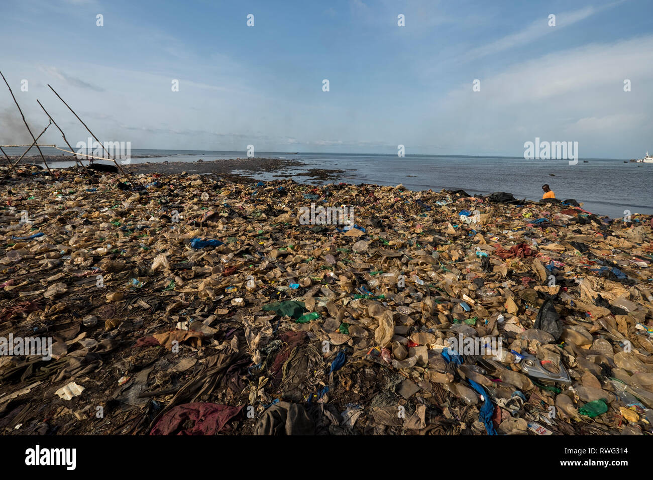 Trash flows to the Atlantic Ocean in Freetown, Sierra Leone. Stock Photo
